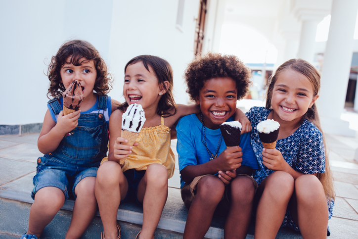 Happy children eating ice cream after successful child therapy and treatment