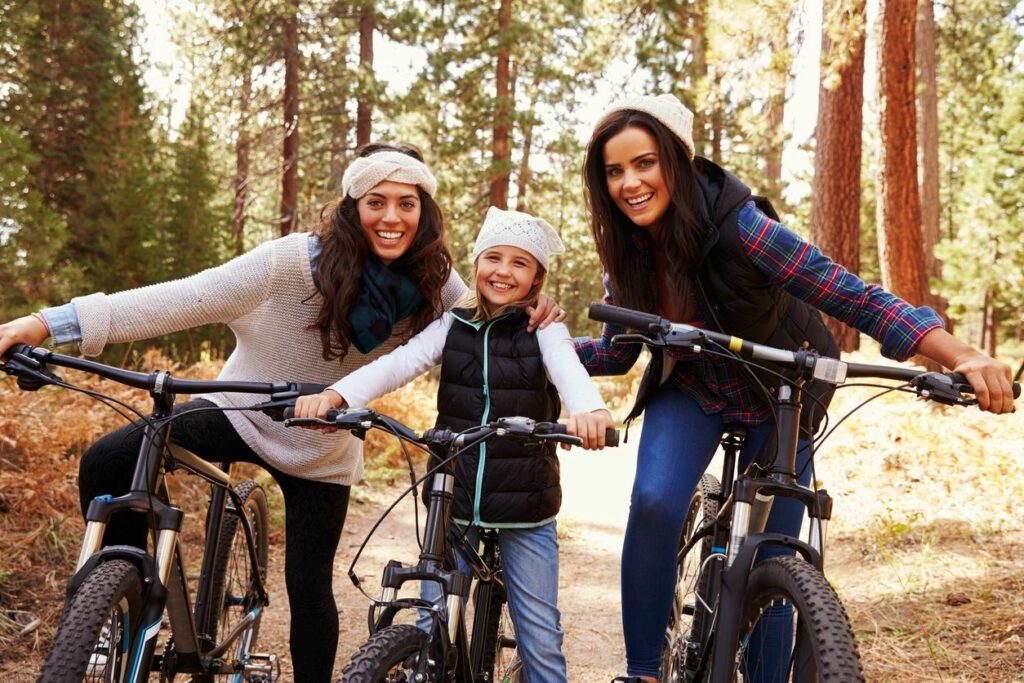 two women and a child riding bikes after receiving depression therapy in Savannah, GA