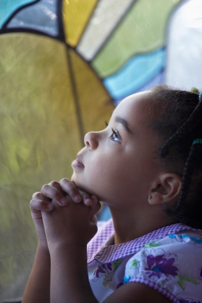 Photo of child praying in christian counseling