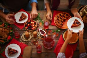 people sitting around a holiday table with an attitude of gratitude