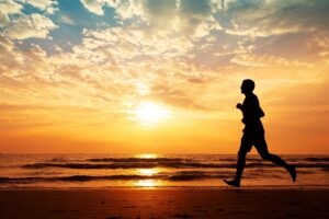 man running on beach after receiving depression therapy in savannah, ga 