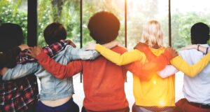 group of people with their arms around each other relieveing anxiety | anxiety therapy in savannah, ga