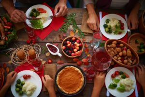 table full of holiday food and the problem of facing eating disorders this holiday season