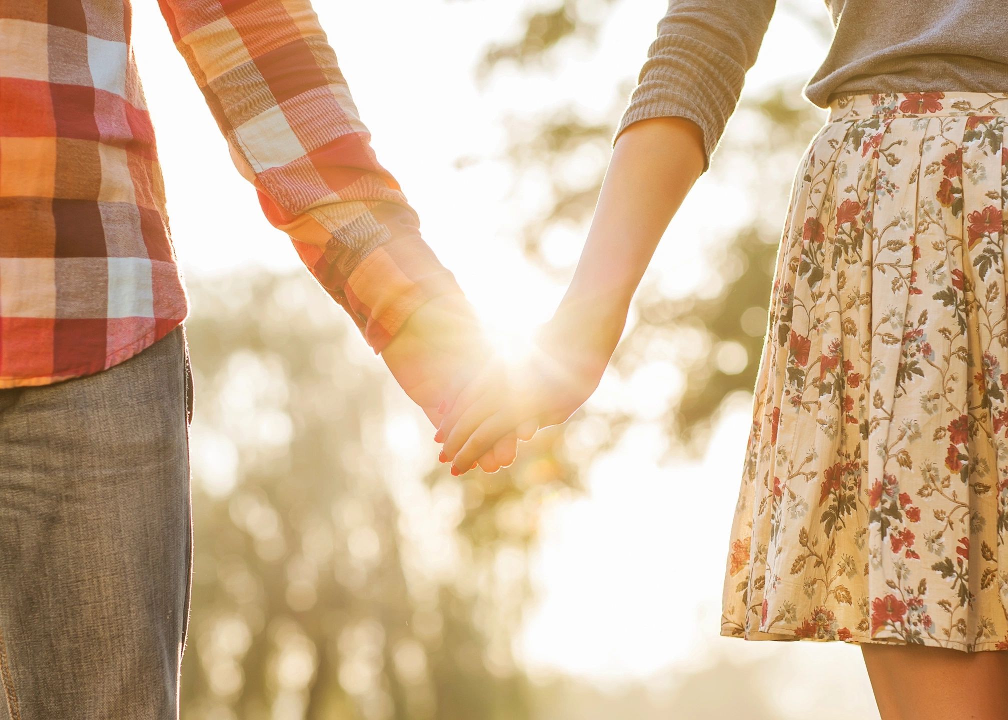 couple holding hands after having success in marriage counseling