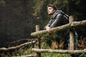 a man contemplating the differences between loneliness and anxiety with help from waters edge counseling