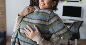 A couple smiles while hugging one another. This could represent overcoming conflict after working with therapists in Savannah, GA. Learn how couples counseling in Savannah, GA can offer support. Search for marriage counseling Savannah, GA to learn more today.
