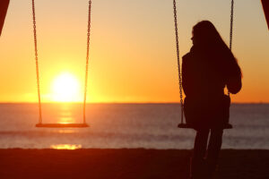 A woman sits in a swing alone while the sun sets in the empty seat next to them. Learn how a grief counselor in Savannah, GA can offer support with grief counseling in Savannah, GA and other services. Search for a counselor near me and get in contact with therapists in Savannah GA today.
