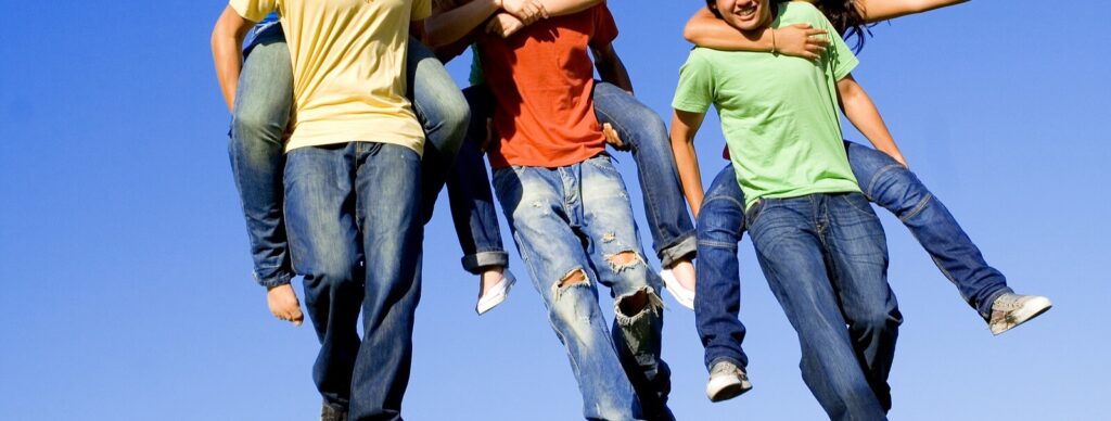 A group of teen friends smiles while giving each other piggyback rides. This could represent the benefits of teens socializing. Learn how therapists in Savannah, GA can offer support in the summer and year-long via counseling for teenagers and other services. Search “counseling savannah, ga” to learn more.
