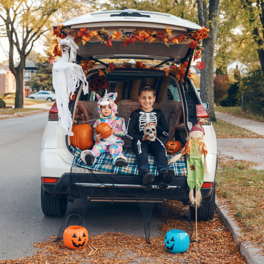 Children in Halloween costumes sit in a car ready to trick or treat. Many children get scared during Halloween. Learn how therapists in Savannah, GA can offer support for navigating fears by searching for “children's therapy savannah, ga” or “phobia counseling savannah” today.