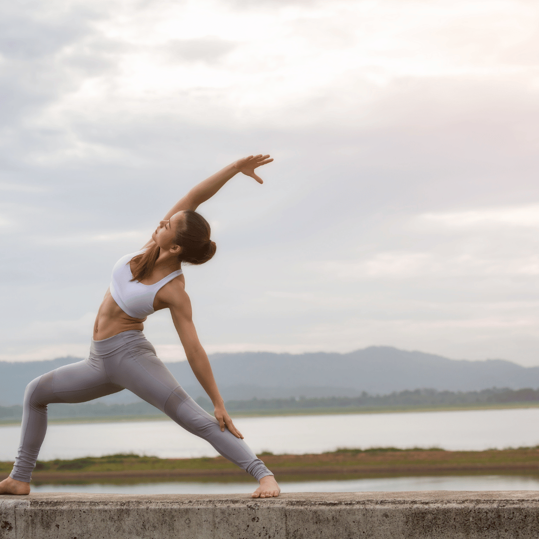 This image of a woman doing yoga represents ways to use yoga, breathwork and meditation in mental health and behavior health in Savannah, GA. 31401 31406